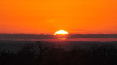 An orange sunset on the Flint Hills of Kansas